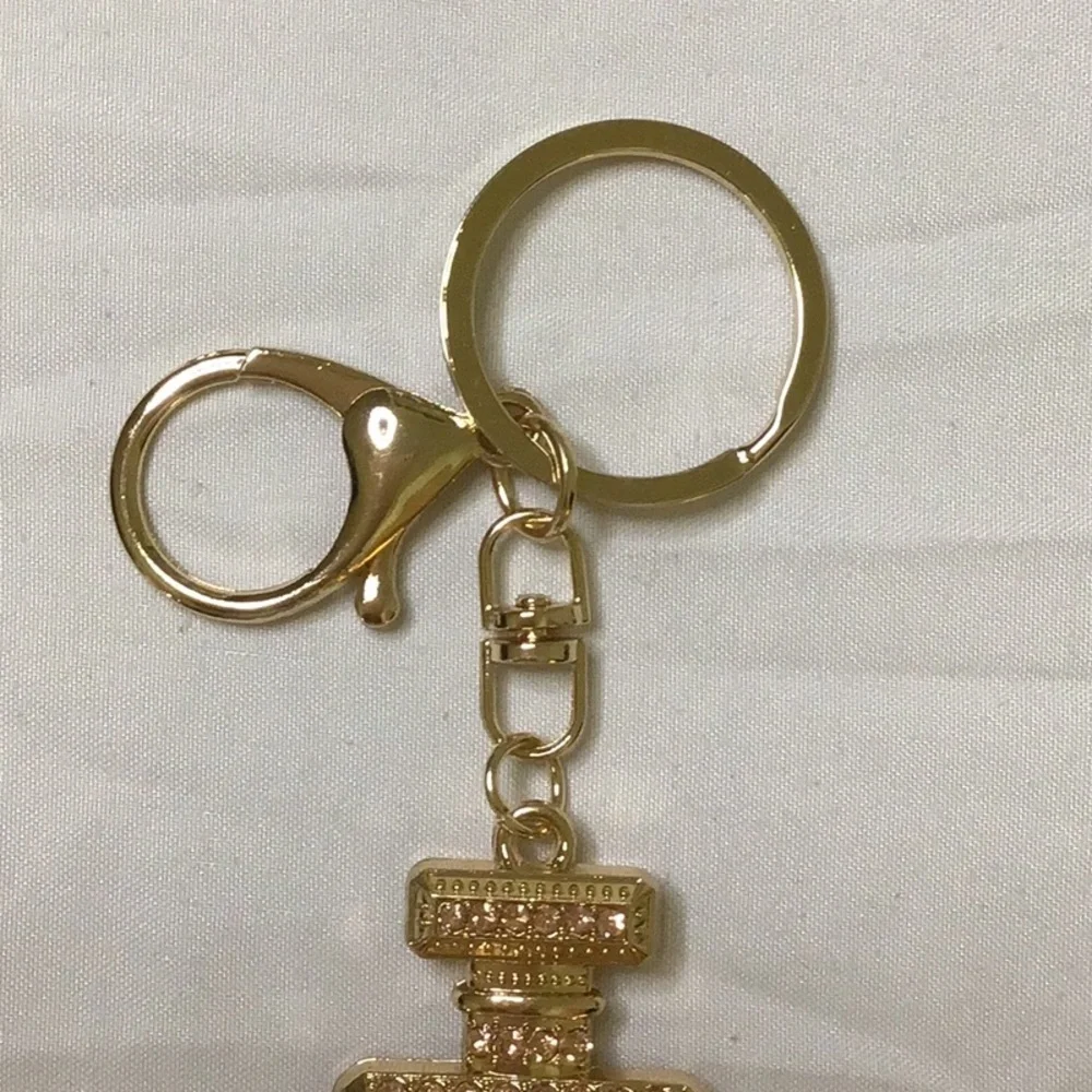 Gold finish Key Holder with‎ Perfume Bottle Design
